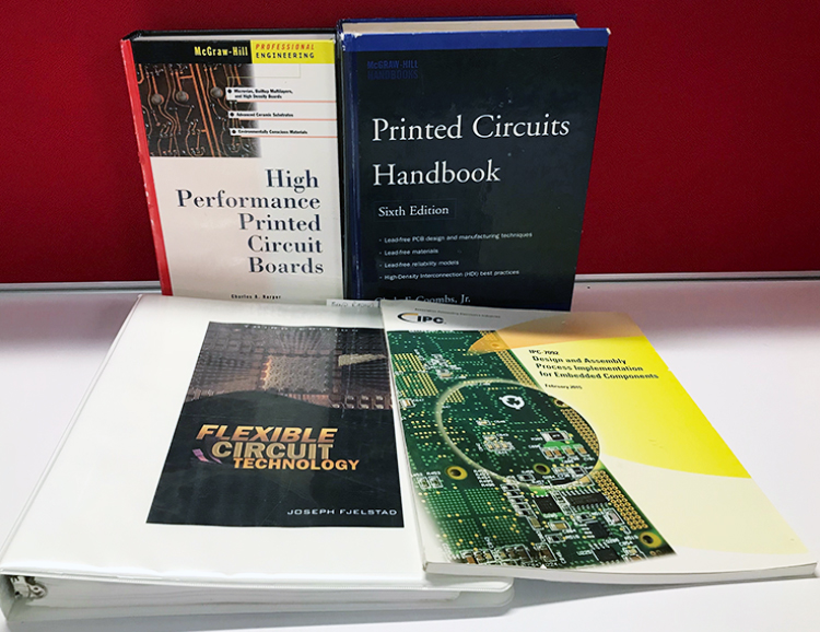Assortment of publications related to PCB design and manufacturing