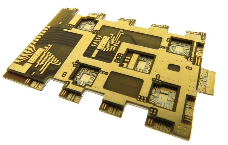 Complex RF hybrid circuit board designed with cavities