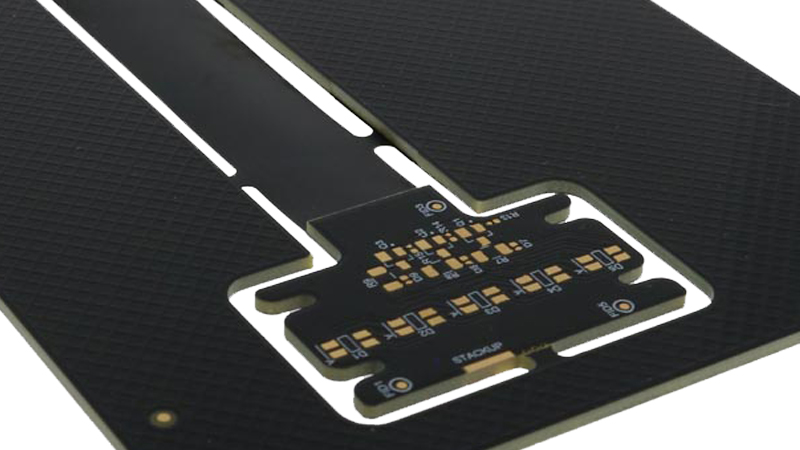 Rigid-flex PCB with black coverlays on the flexible sections.